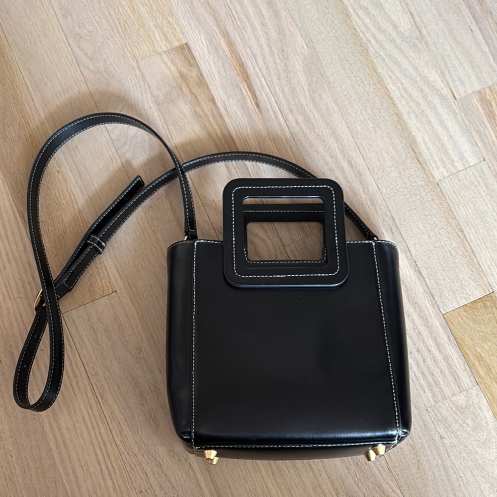 STAUD Black Crossbody Bag with Minimalist Design and Versatile Strap